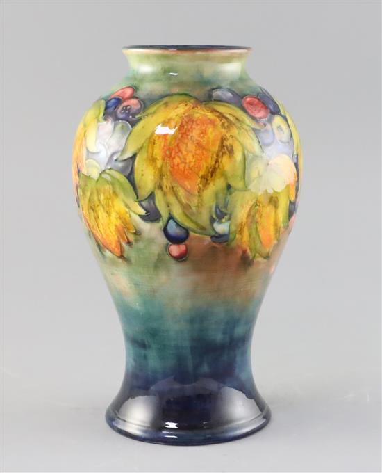 A Moorcroft leaf and berry flambe baluster vase, 1930s, H.14.2cm